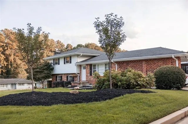 front view of a house with a yard