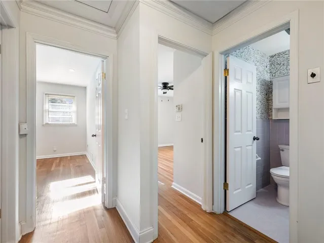 a view of a bathroom from a hallway
