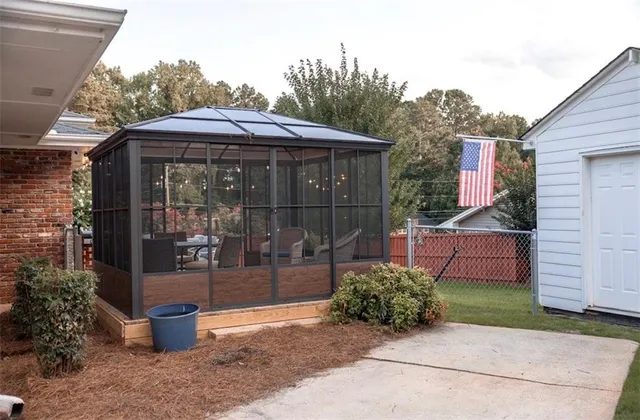 a backyard of a house with yard fire pit and outdoor seating