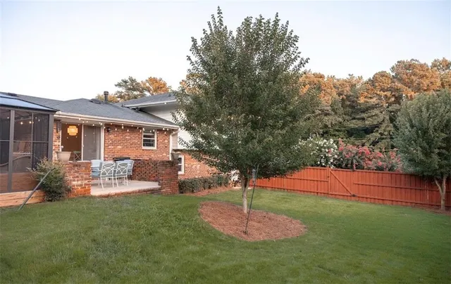a view of a patio with a table and chairs