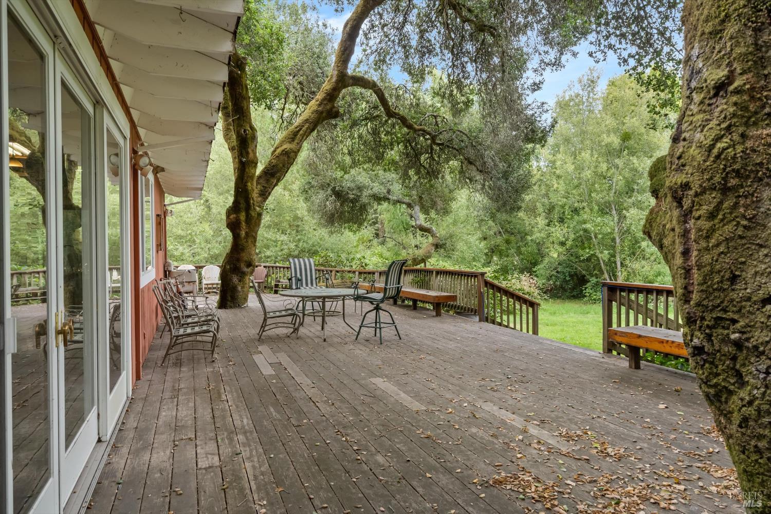 8157 Mill Station Road Sebastopol, CA 95472 - Photo 10 of 27 a view of a patio with table and chairs and wooden floor
