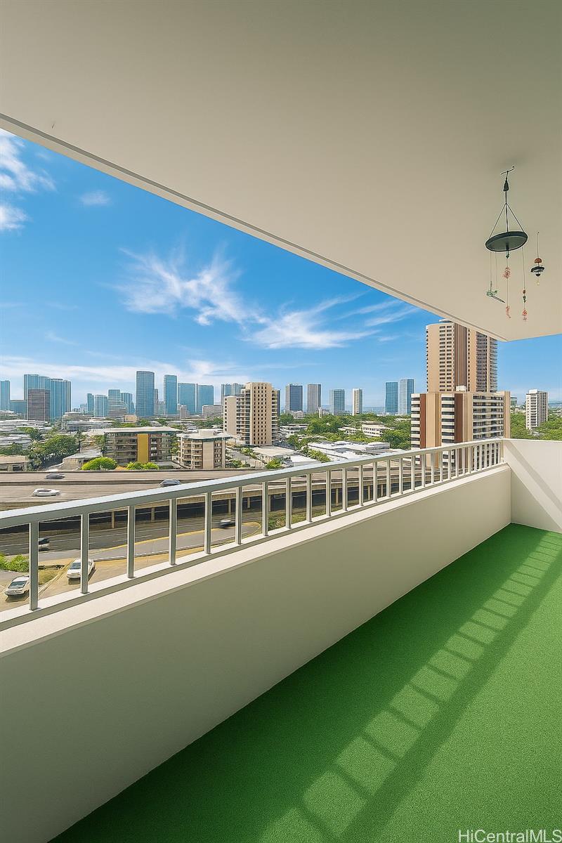 1400 Pensacola Street, Unit 903 Honolulu, HI 96822 - Photo 11 of 14 a view of a large building with a big yard