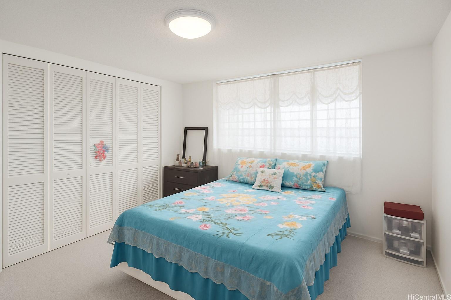 1400 Pensacola Street, Unit 903 Honolulu, HI 96822 - Photo 5 of 14 a bedroom with a bed and a window