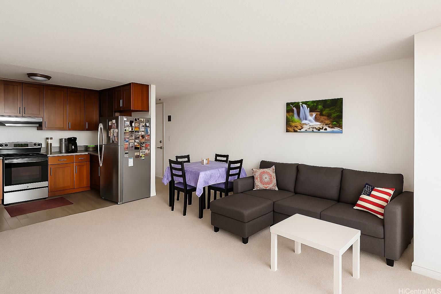 1400 Pensacola Street, Unit 903 Honolulu, HI 96822 - Photo 9 of 14 a living room with furniture and a kitchen