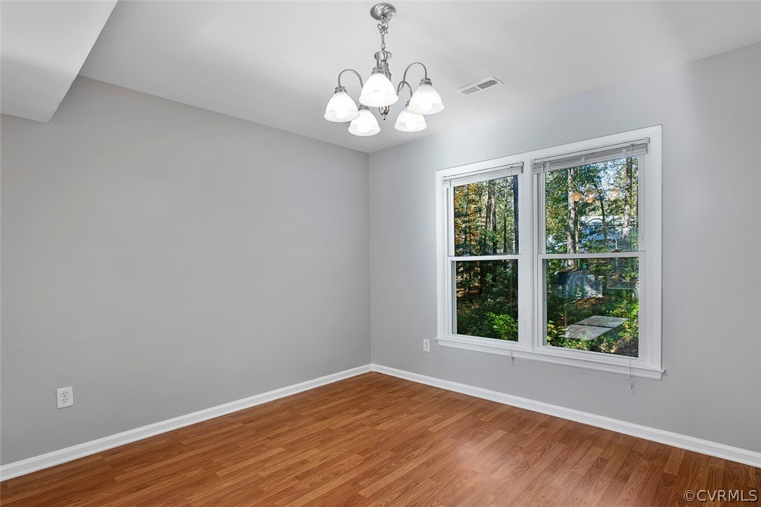 4501 Rabbit Foot Lane North Chesterfield, VA 23236 - Photo 11 of 32 a view of an empty room with wooden floor and a window