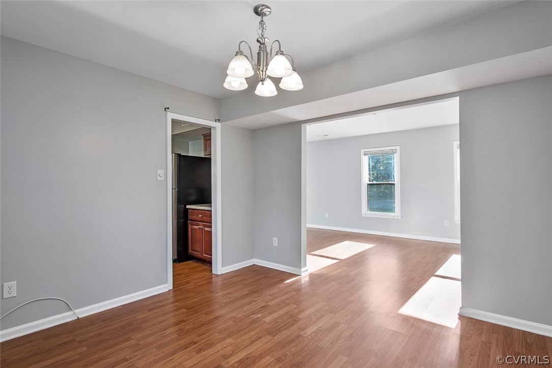 4501 Rabbit Foot Lane North Chesterfield, VA 23236 - Photo 12 of 32 a view of an empty room with wooden floor and a window