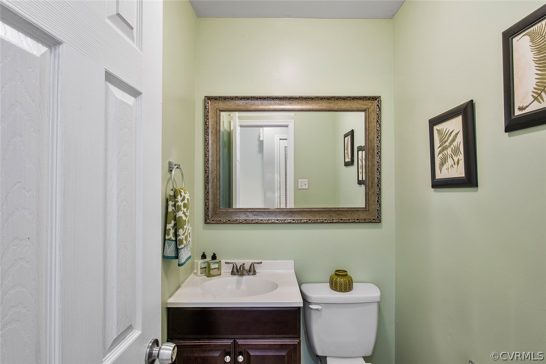 4501 Rabbit Foot Lane North Chesterfield, VA 23236 - Photo 16 of 32 a bathroom with a toilet sink and mirror