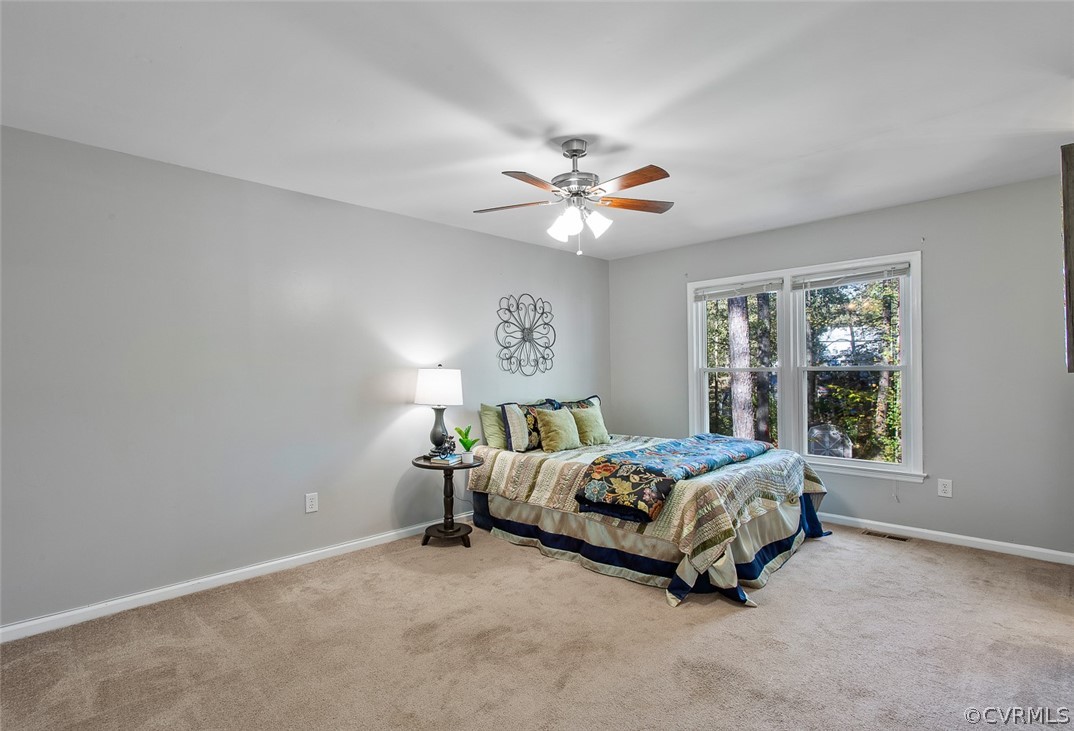 4501 Rabbit Foot Lane North Chesterfield, VA 23236 - Photo 17 of 32 a bed sitting in a bedroom next to a window