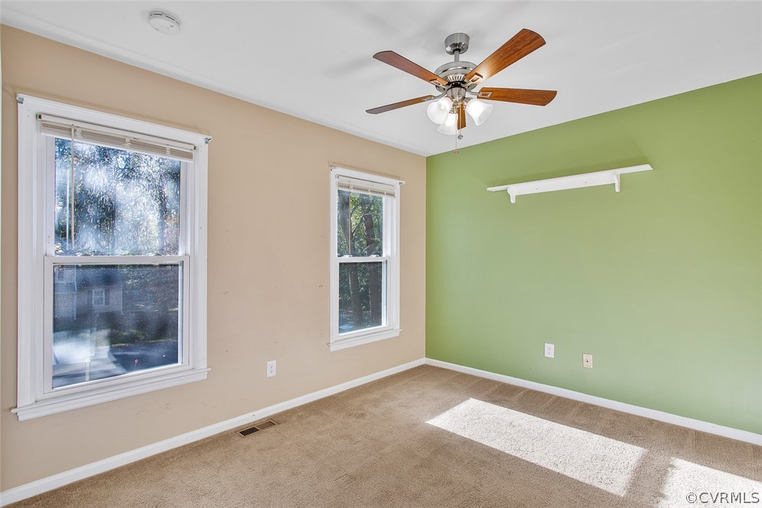 4501 Rabbit Foot Lane North Chesterfield, VA 23236 - Photo 22 of 32 a view of an empty room with a window and a fan