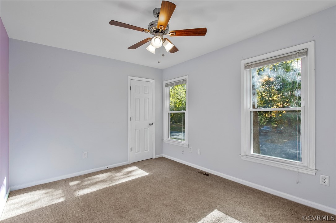 4501 Rabbit Foot Lane North Chesterfield, VA 23236 - Photo 23 of 32 a view of a livingroom with a ceiling fan and window