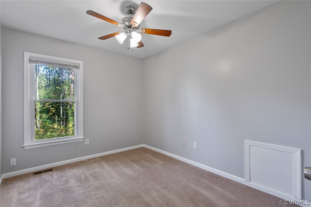 4501 Rabbit Foot Lane North Chesterfield, VA 23236 - Photo 24 of 32 an empty room with a window and a fan