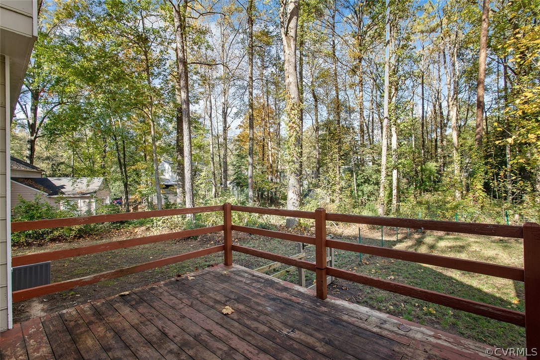 4501 Rabbit Foot Lane North Chesterfield, VA 23236 - Photo 26 of 32 a view of a wooden bench and trees in front of a house