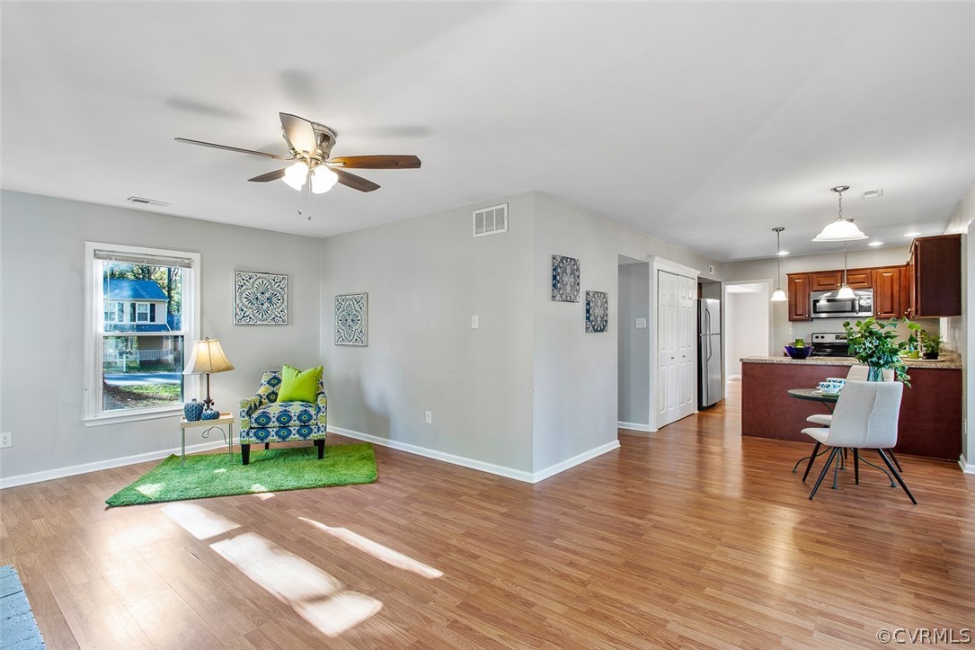 4501 Rabbit Foot Lane North Chesterfield, VA 23236 - Photo 32 of 32 a living room with furniture and a wooden floor