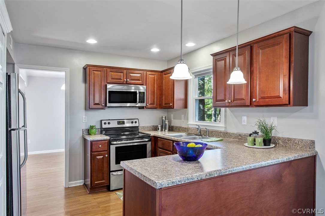 4501 Rabbit Foot Lane North Chesterfield, VA 23236 - Photo 8 of 32 a kitchen with stainless steel appliances granite countertop a sink stove and refrigerator