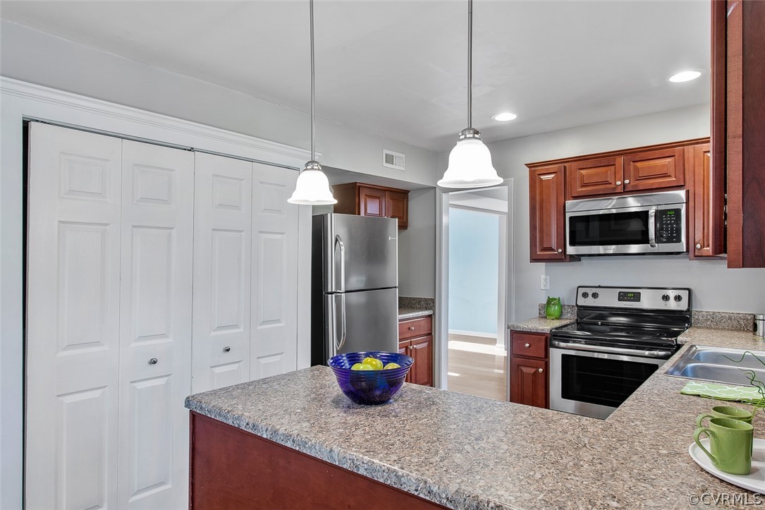 4501 Rabbit Foot Lane North Chesterfield, VA 23236 - Photo 9 of 32 a kitchen with stainless steel appliances granite countertop a sink a stove and a refrigerator