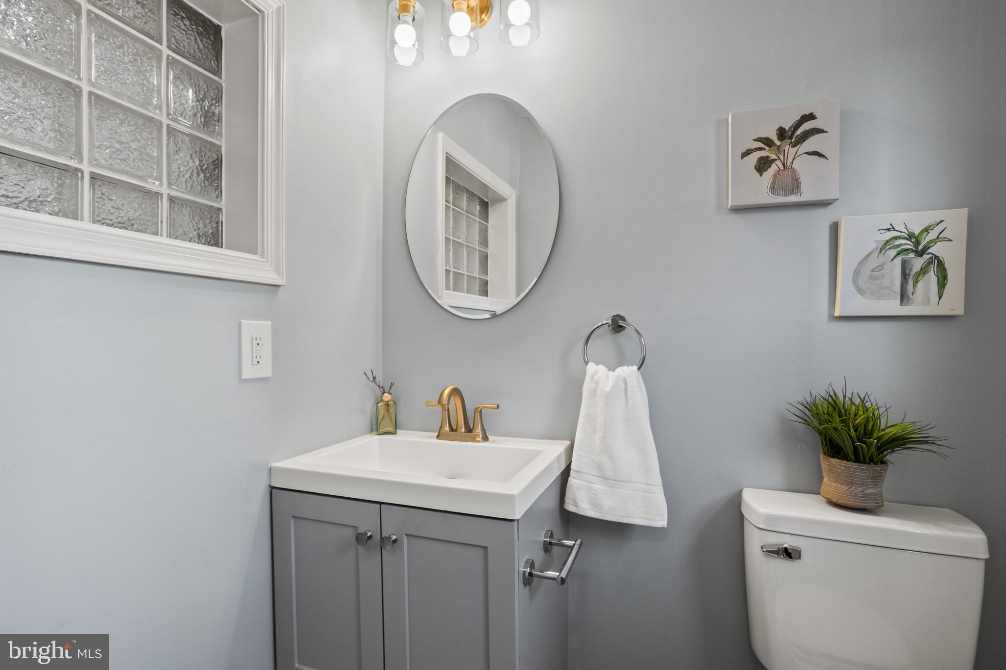 1432 Andre Street Baltimore, MD 21230 - Photo 11 of 25 a bathroom with a sink and a mirror