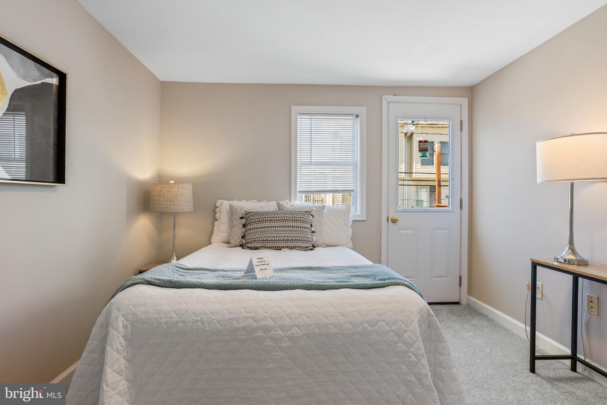 1432 Andre Street Baltimore, MD 21230 - Photo 13 of 25 a bedroom with a bed and a night stand