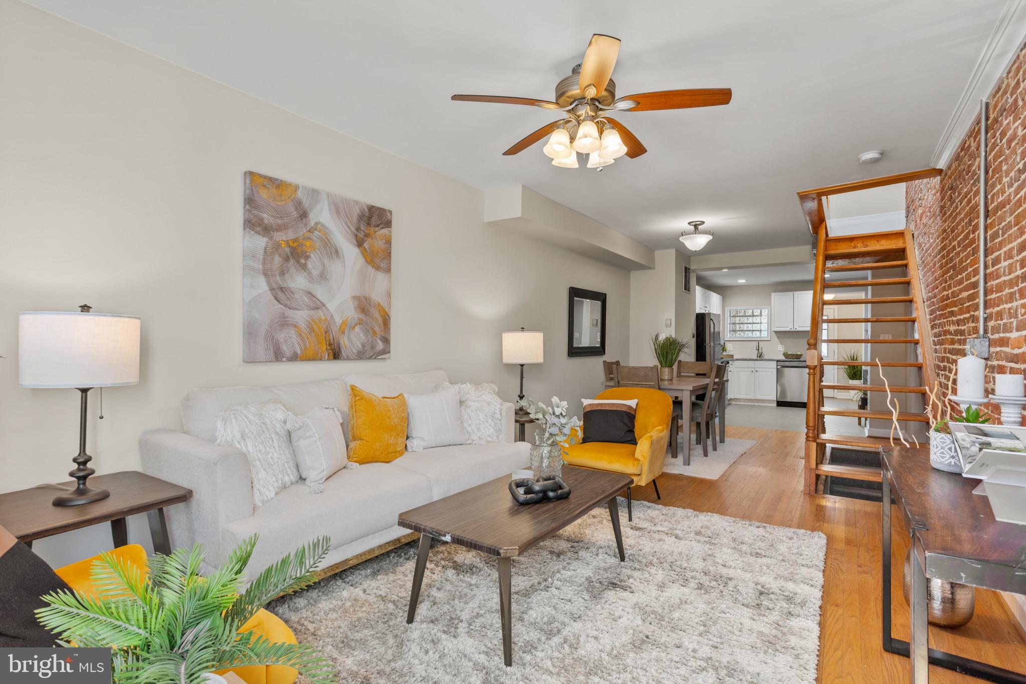 1432 Andre Street Baltimore, MD 21230 - Photo 2 of 25 a living room with furniture and a lamp