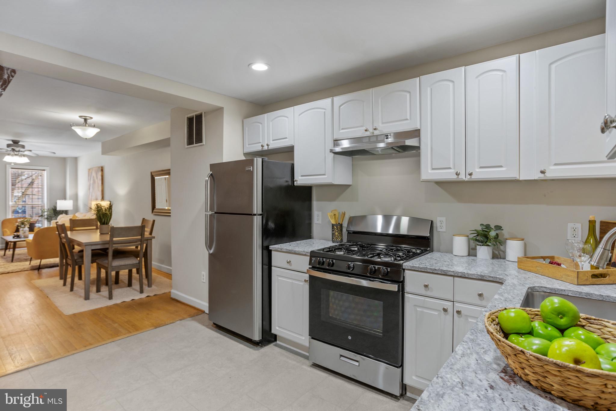 1432 Andre Street Baltimore, MD 21230 - Photo 25 of 25 a kitchen with stainless steel appliances granite countertop a refrigerator stove microwave and sink
