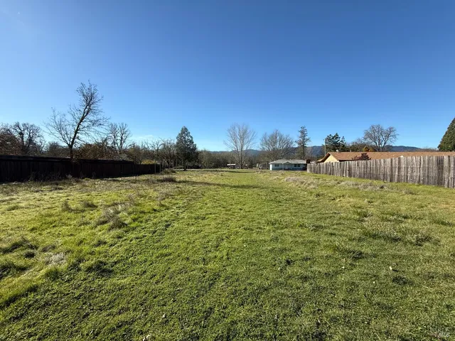 a view of a lake with a house in the background