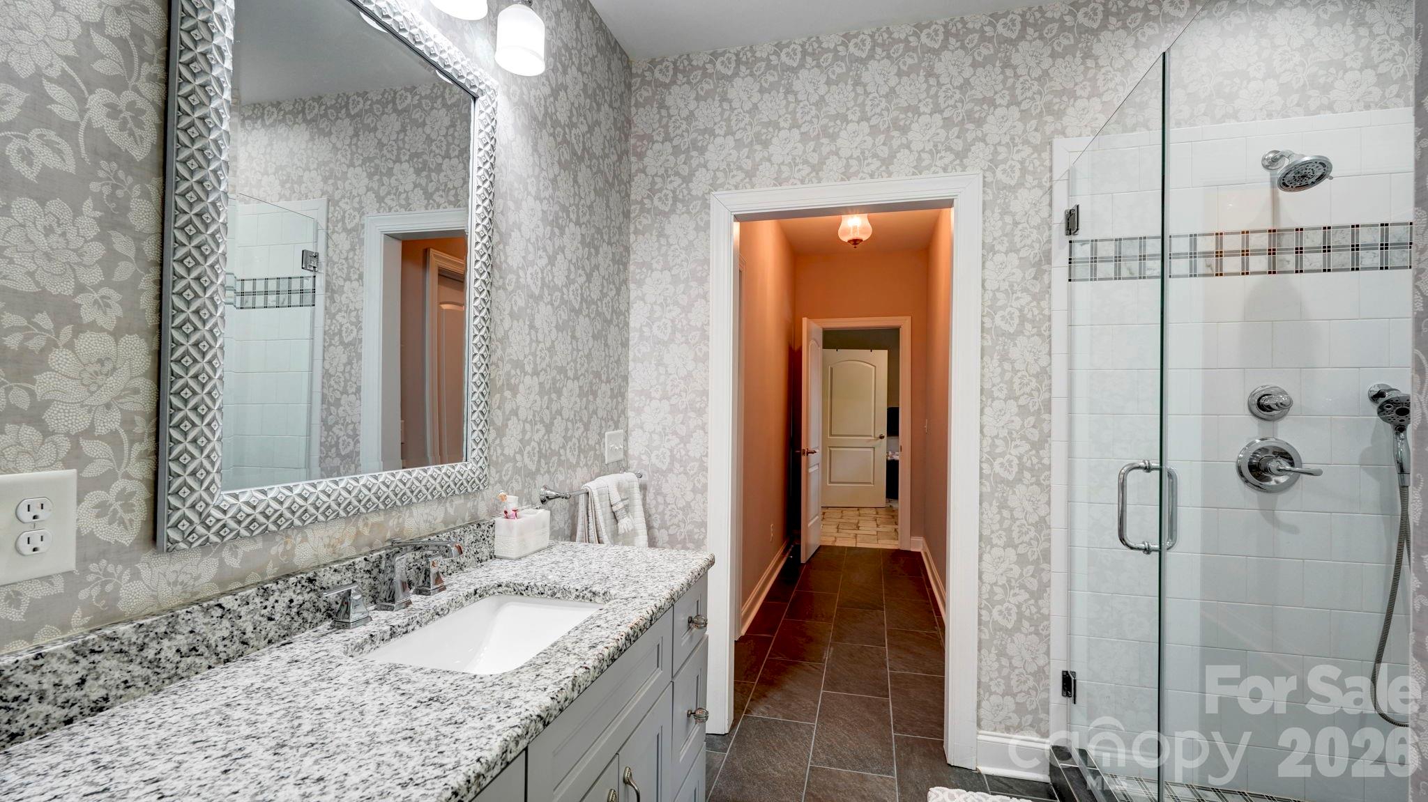 1775 Enochville Road Kannapolis, NC 28081 - Photo 35 of 41 a bathroom with a granite countertop sink and a mirror