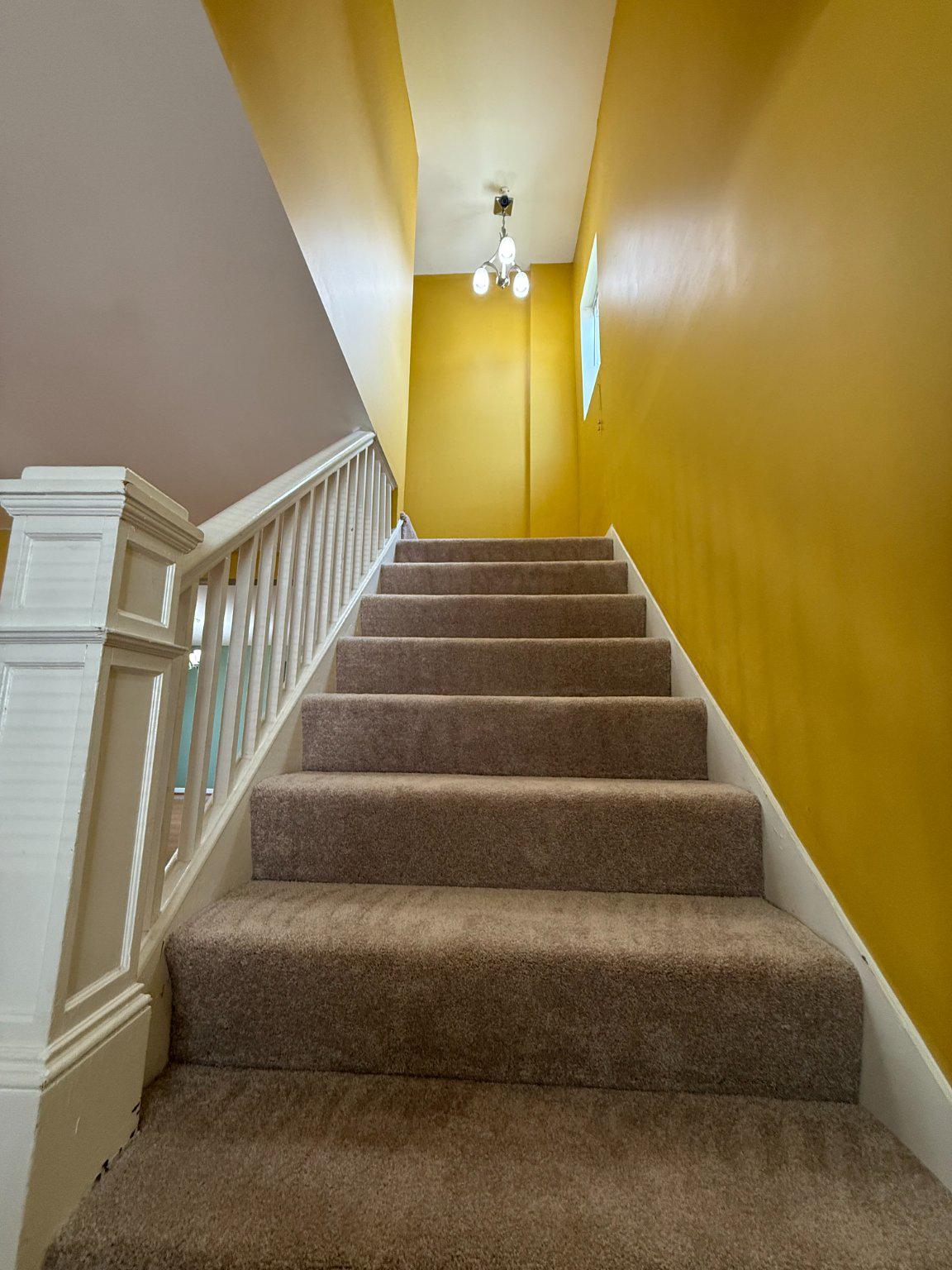 123 Winters Lane Baltimore, MD 21228 - Photo 10 of 28 Bright ascent to two bedrooms with full bathrooms.