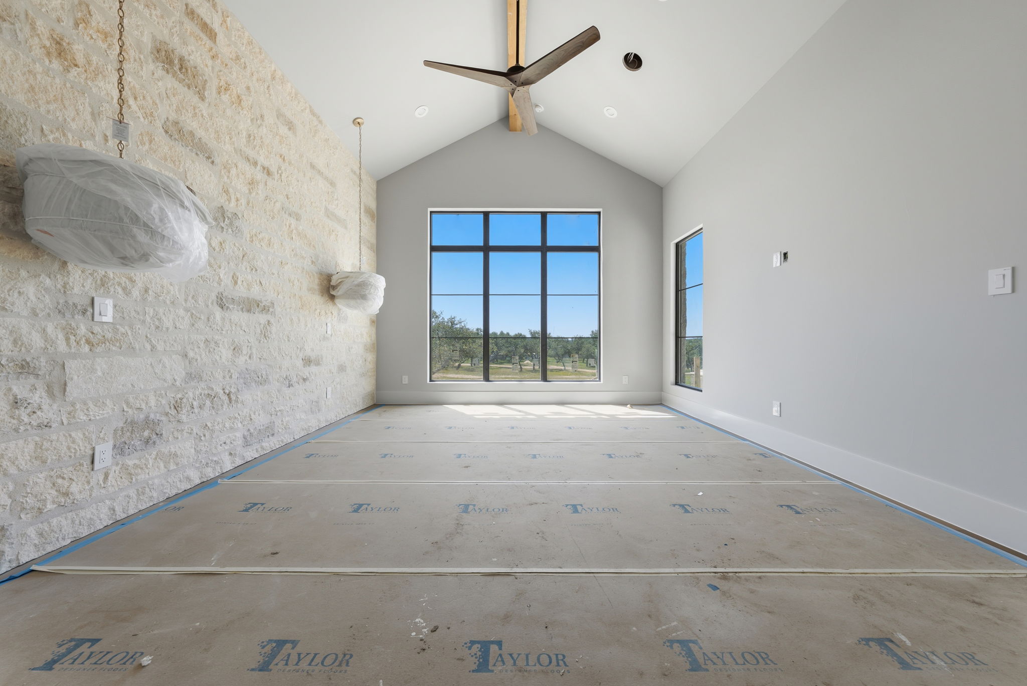 3300 Rm -165 Dripping Springs Dripping Springs, TX 78620 - Photo 10 of 32 a view of a livingroom with a ceiling fan and window