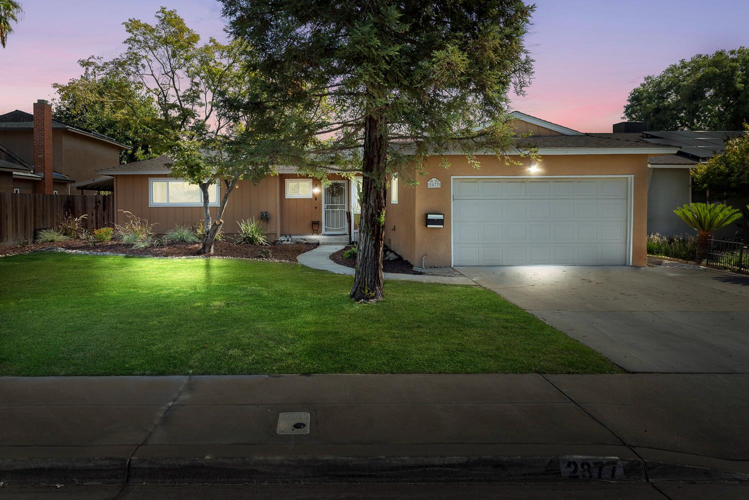 2877 Caesar Avenue Clovis, CA 93612 - Photo 1 of 32 a view of a back yard of the house