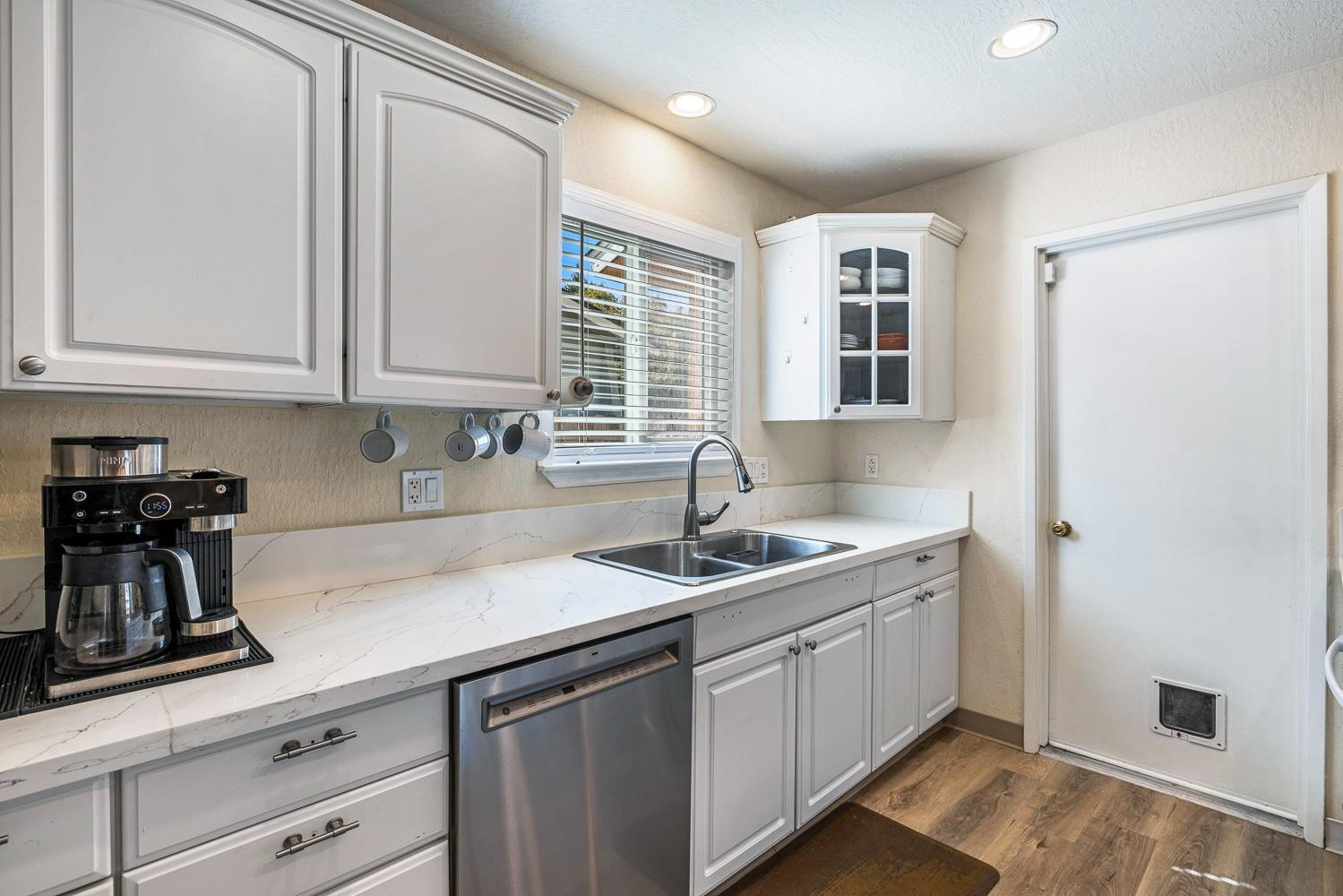 2877 Caesar Avenue Clovis, CA 93612 - Photo 14 of 32 a kitchen with a sink cabinets and window