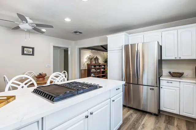 a kitchen with a sink and a stove top oven