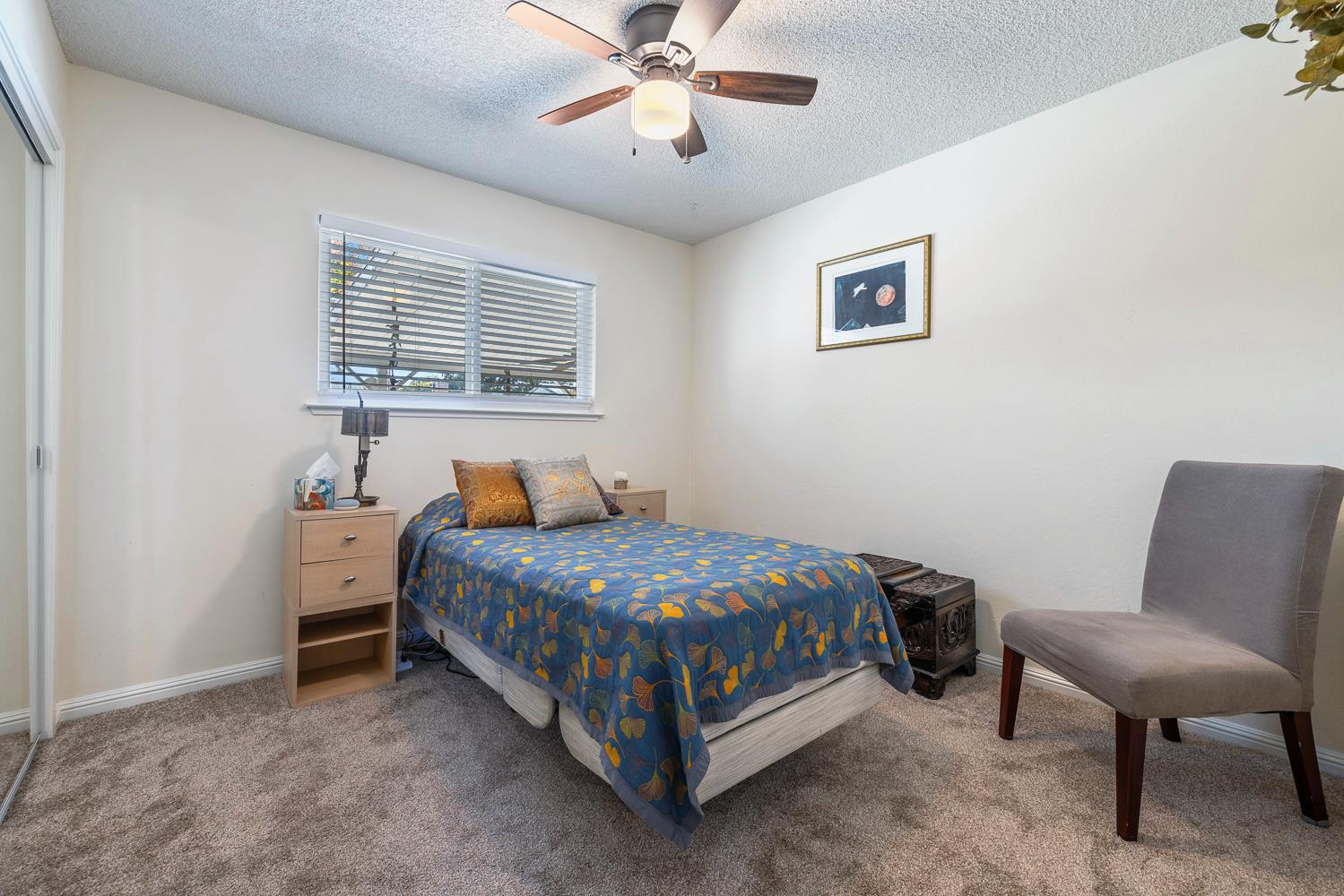 2877 Caesar Avenue Clovis, CA 93612 - Photo 20 of 32 a bed room with a bed and a chair