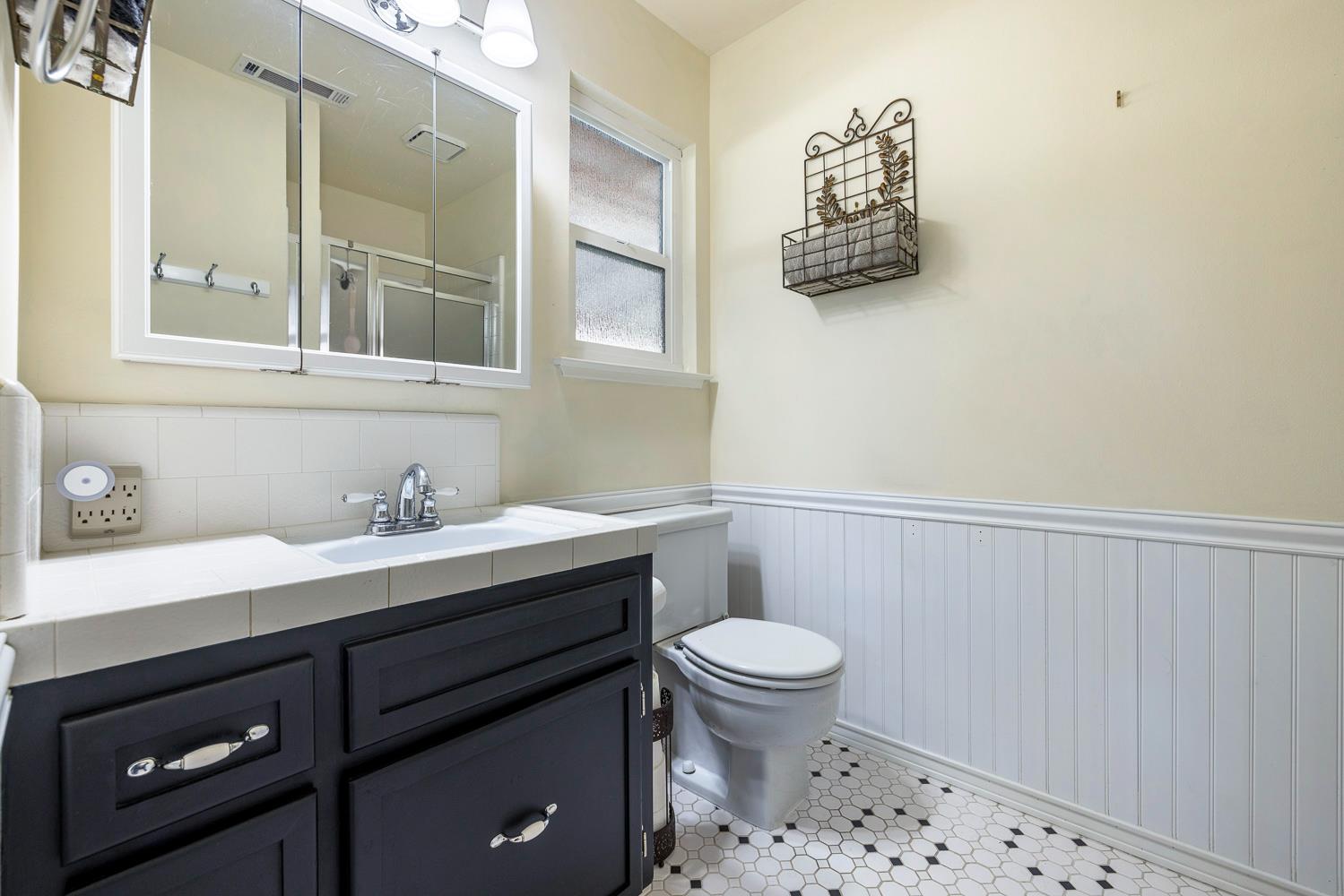 2877 Caesar Avenue Clovis, CA 93612 - Photo 25 of 32 a bathroom with a sink toilet and vanity