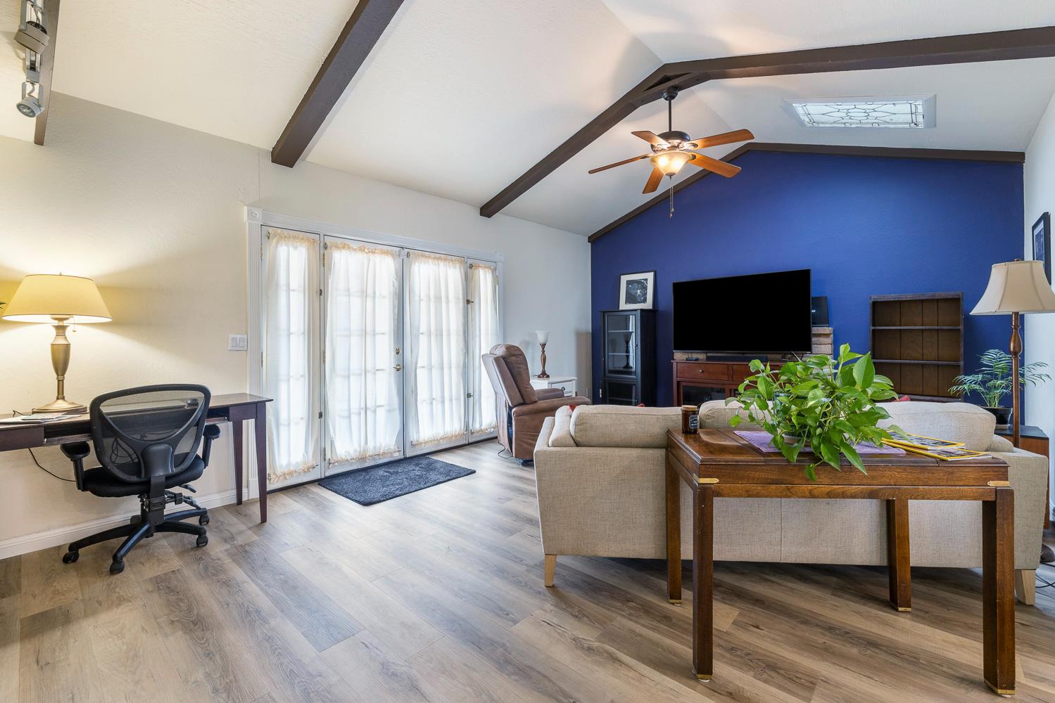 2877 Caesar Avenue Clovis, CA 93612 - Photo 4 of 32 a living room with furniture and a flat screen tv