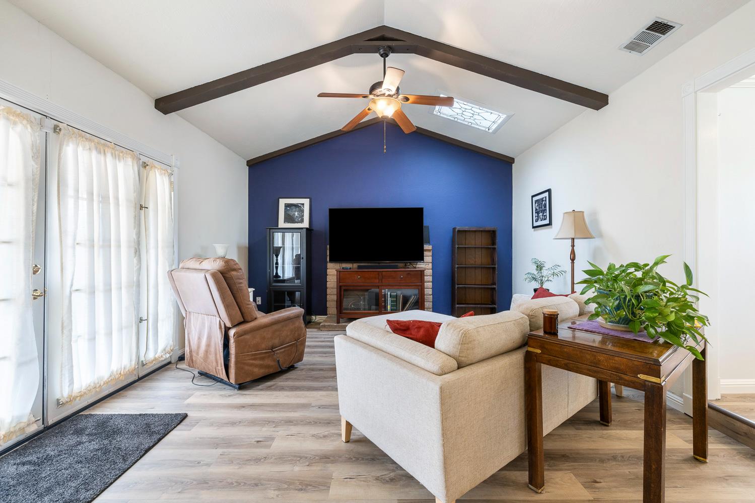 2877 Caesar Avenue Clovis, CA 93612 - Photo 5 of 32 a living room with furniture and a flat screen tv