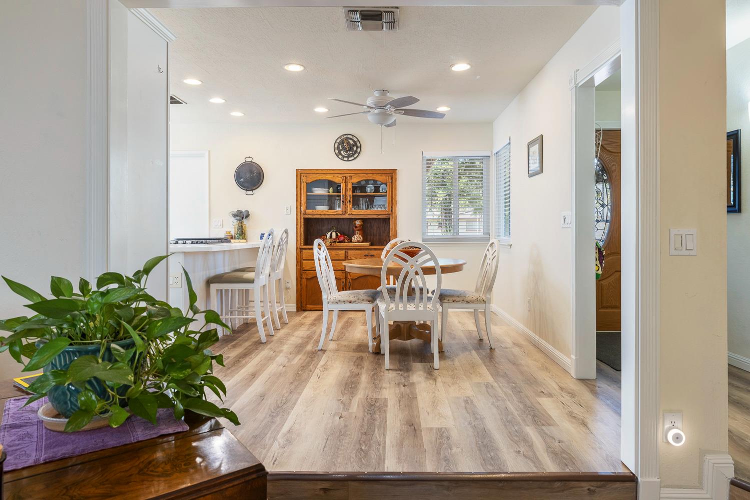 2877 Caesar Avenue Clovis, CA 93612 - Photo 9 of 32 a view of a dining room with furniture and a potted plant