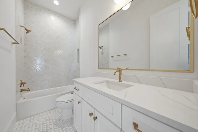 a bathroom with a sink a toilet and a bathtub