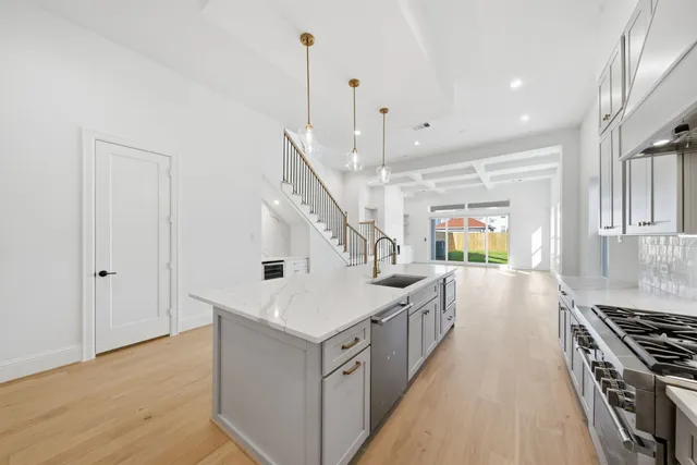 a kitchen with counter top space and stainless steel appliances