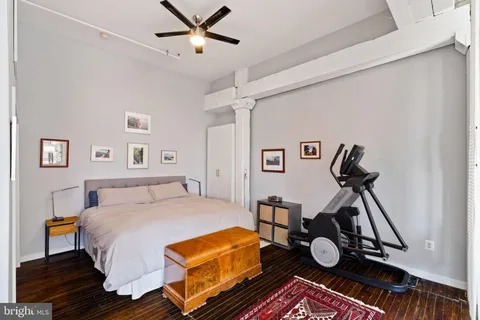 a bed room with a bed and a window