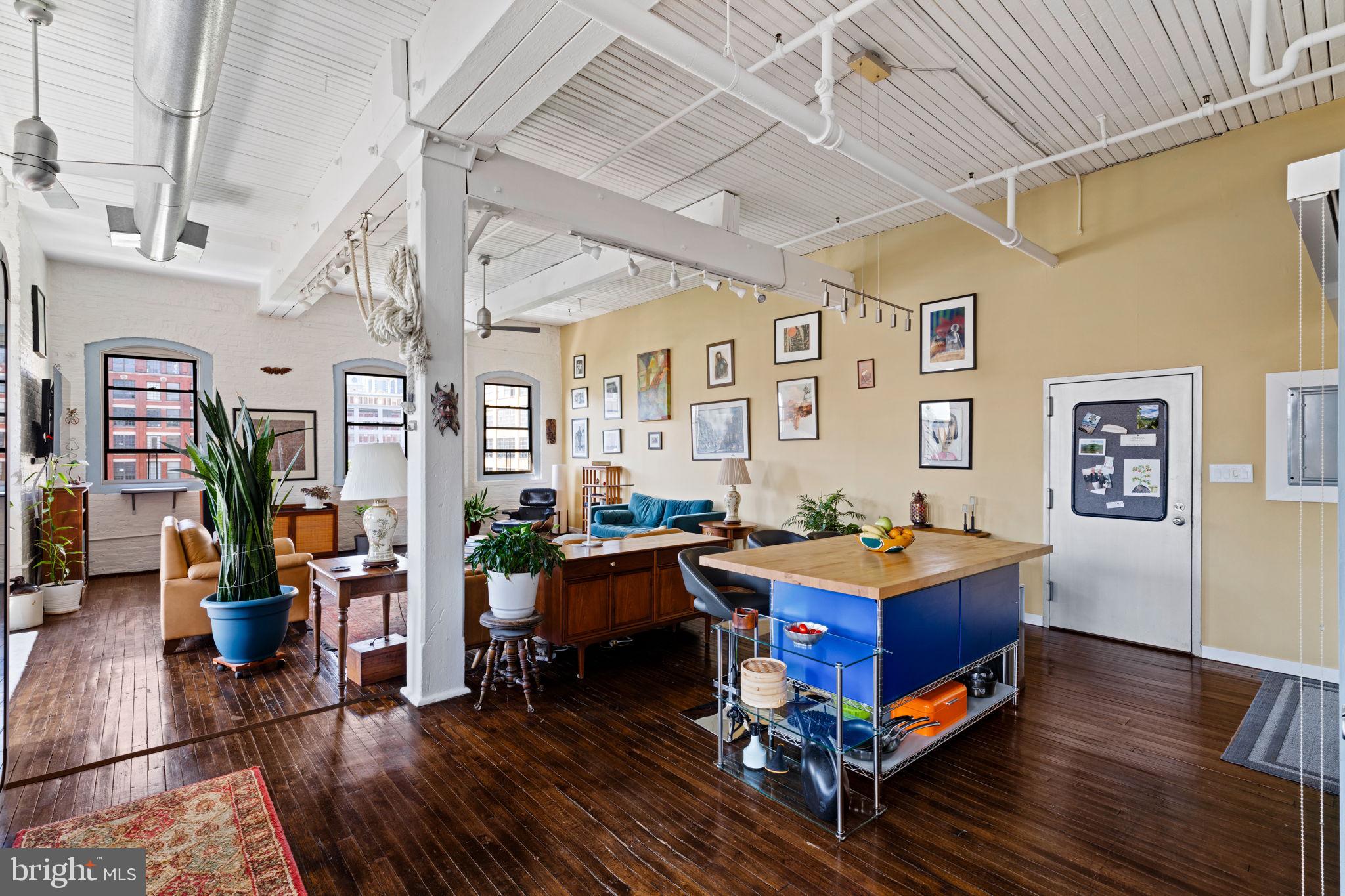 429 North 13th Street, Unit 5G Philadelphia, PA 19123 - Photo 3 of 39 a living room with furniture pool table and wooden floor