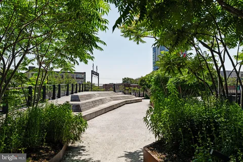 a view of a house with pool and sitting area