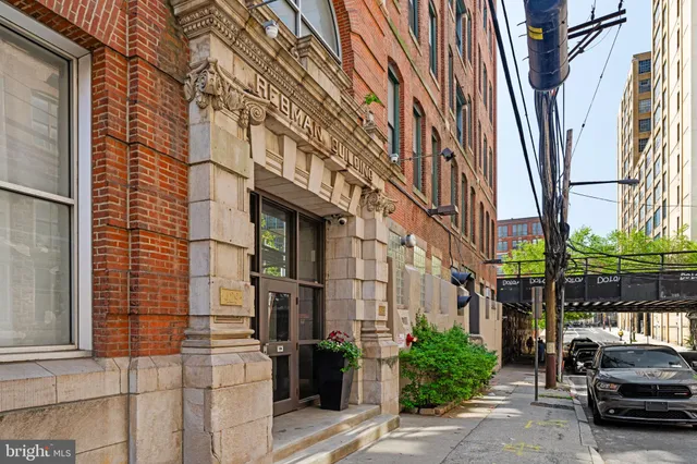 a car parked in front of brick building