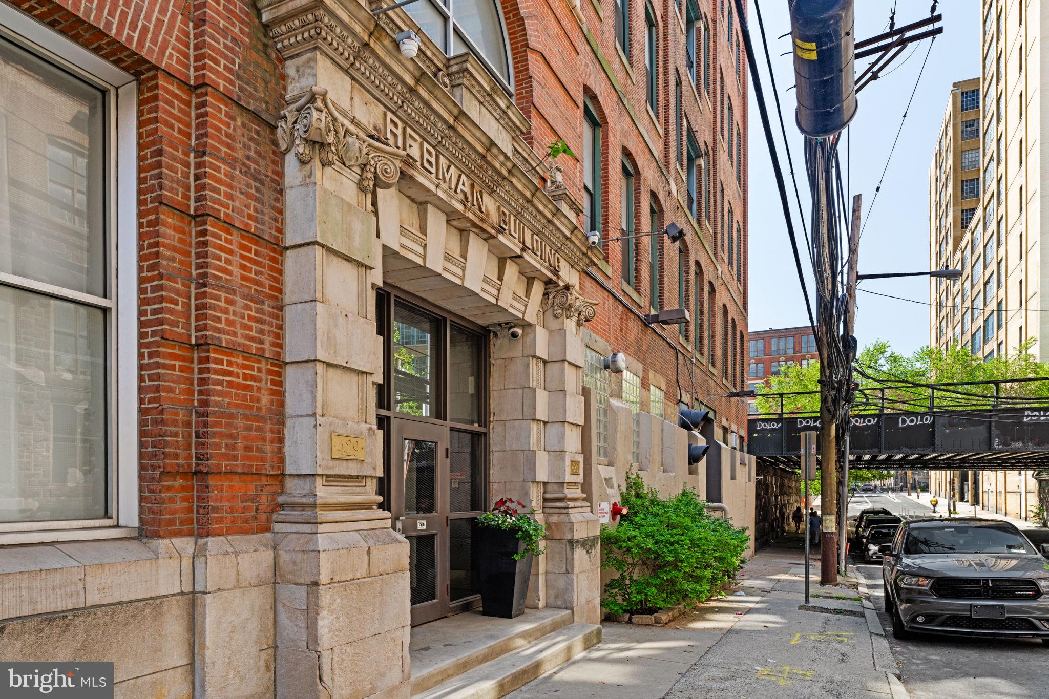 429 North 13th Street, Unit 5G Philadelphia, PA 19123 - Photo 38 of 39 a car parked in front of brick building