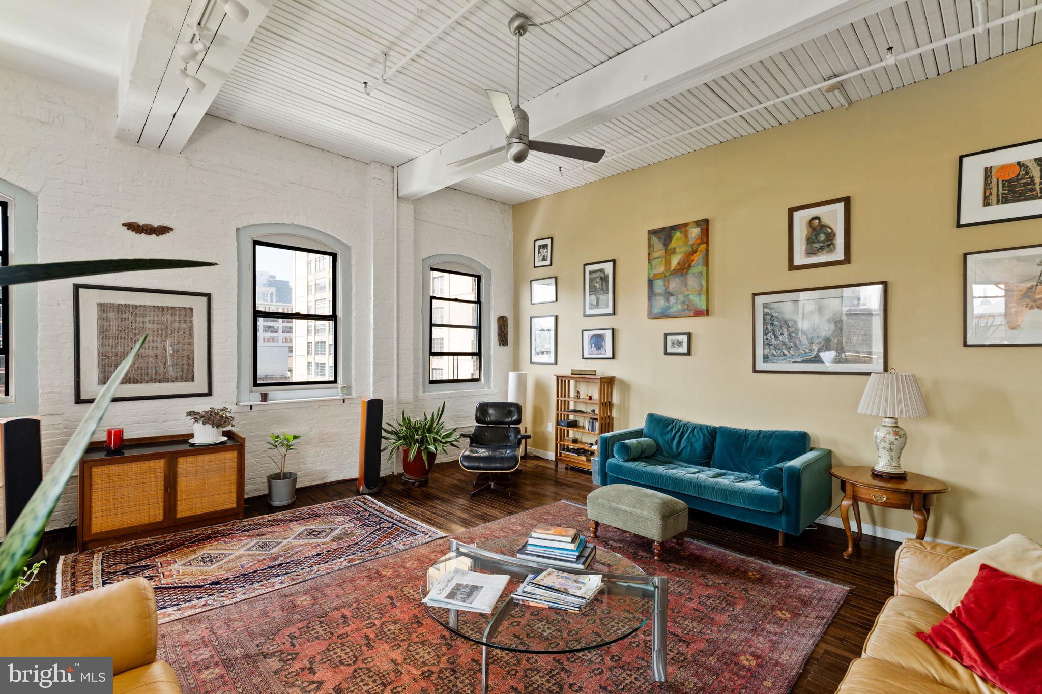 429 North 13th Street, Unit 5G Philadelphia, PA 19123 - Photo 8 of 39 a living room with furniture and a window