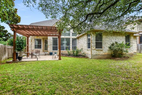 a view of a house with a yard porch and sitting area