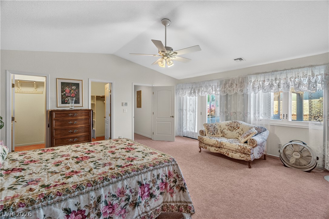 2055 Cholla Way Laughlin, NV 89029 - Photo 30 of 87 A restful retreat, this primary bedroom includes a private sitting area and outdoor access.