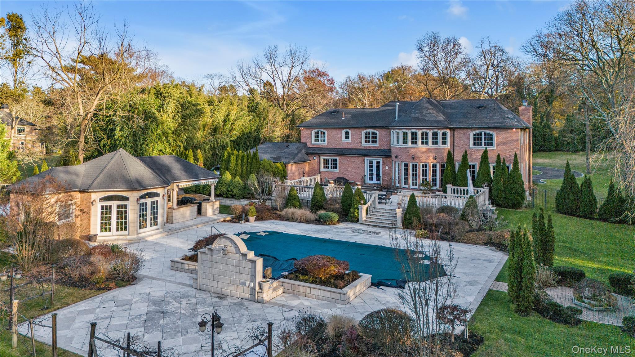 109 Wheatley Road Glen Head, NY 11545 - Photo 2 of 47 a front view of a house with garden and sitting area
