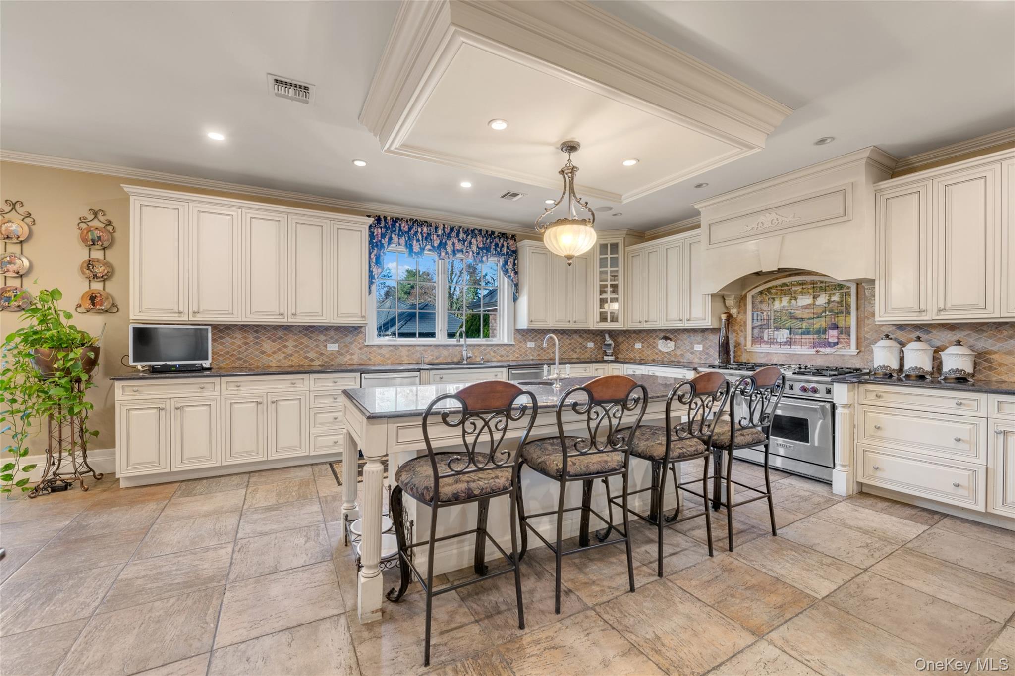 109 Wheatley Road Glen Head, NY 11545 - Photo 26 of 47 a kitchen with cabinets and chairs