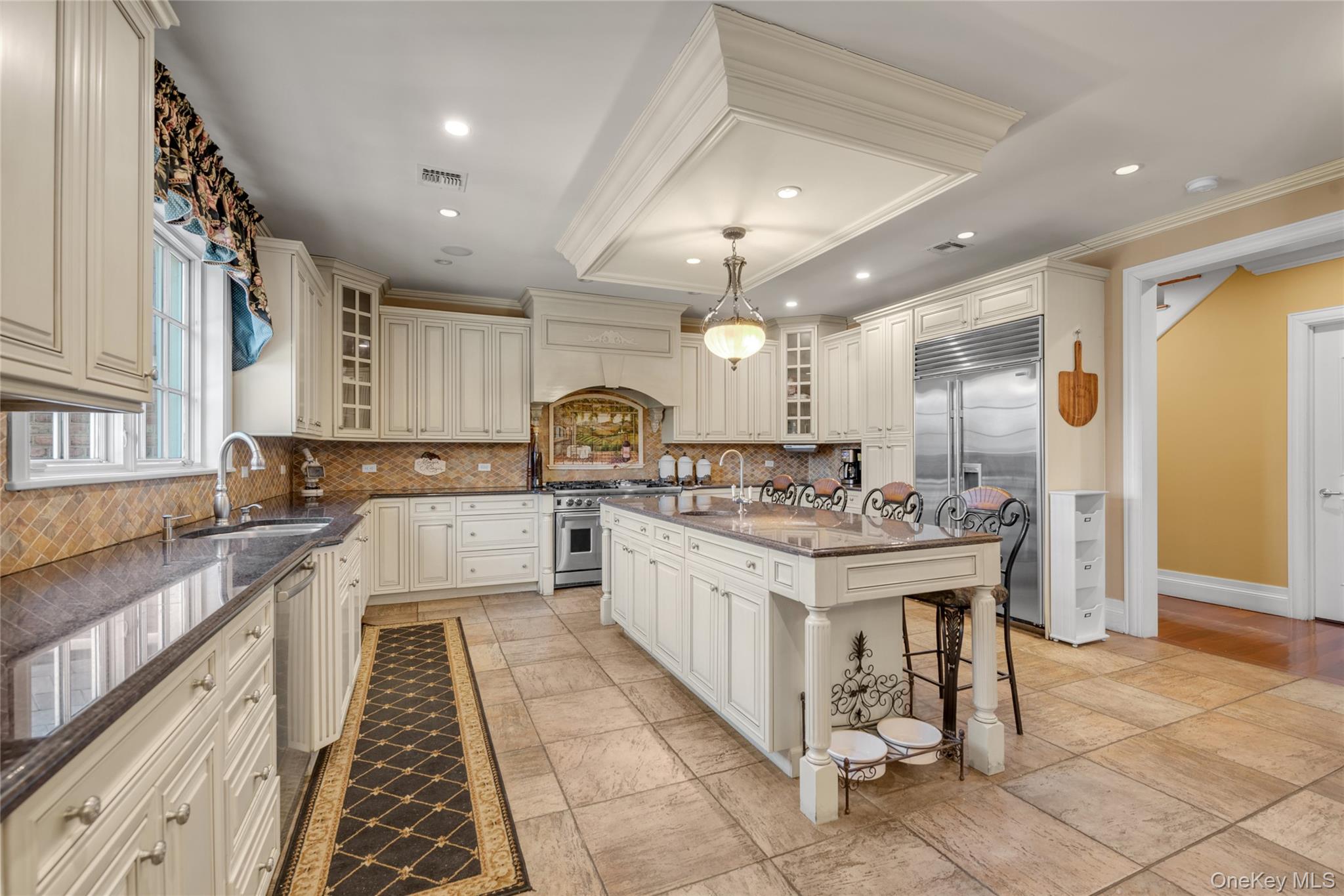 109 Wheatley Road Glen Head, NY 11545 - Photo 28 of 47 a large white kitchen with a large window