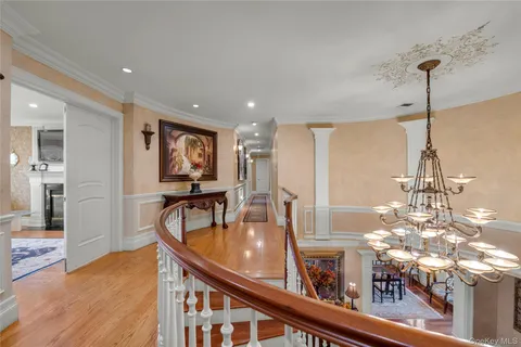 a view of a living room and chandelier