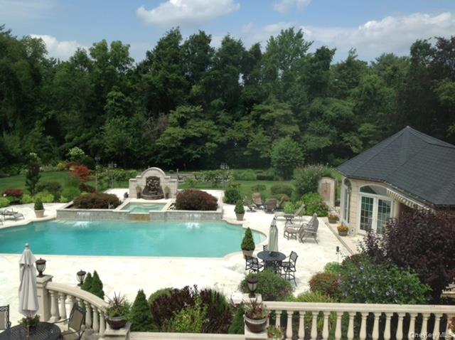 109 Wheatley Road Glen Head, NY 11545 - Photo 38 of 47 a view of a house with backyard sitting area and lake view